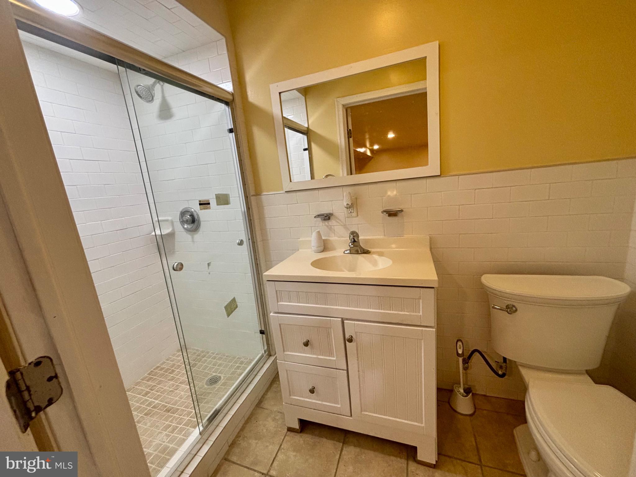 141 Arneys Mt Road Pemberton, NJ 08068 - Photo 23 of 27 a bathroom with a sink a toilet a mirror and shower
