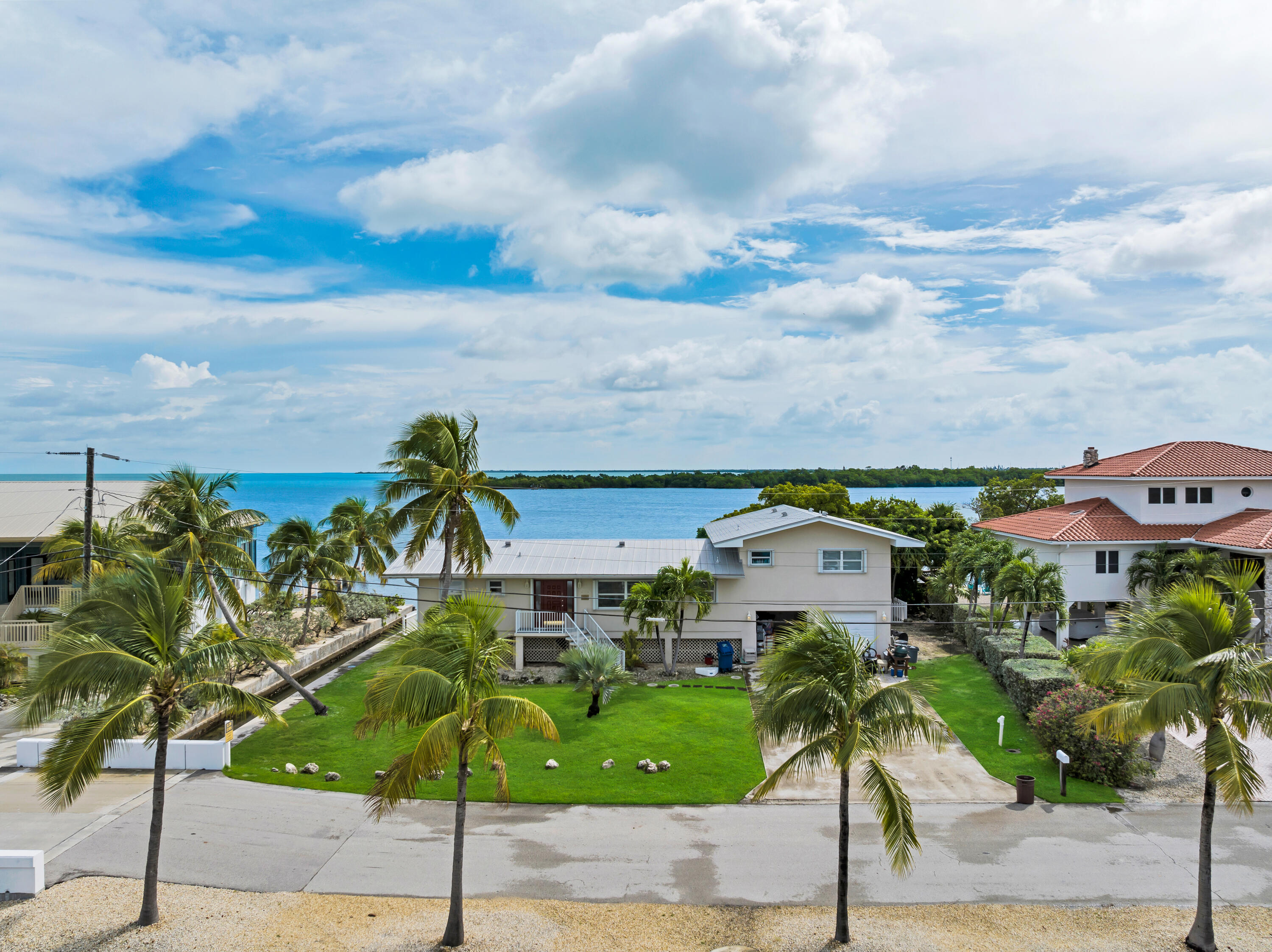 351 Stirrup Key Boulevard Marathon, FL 33050 - Photo 2 of 21 a picture of houses with outdoor space