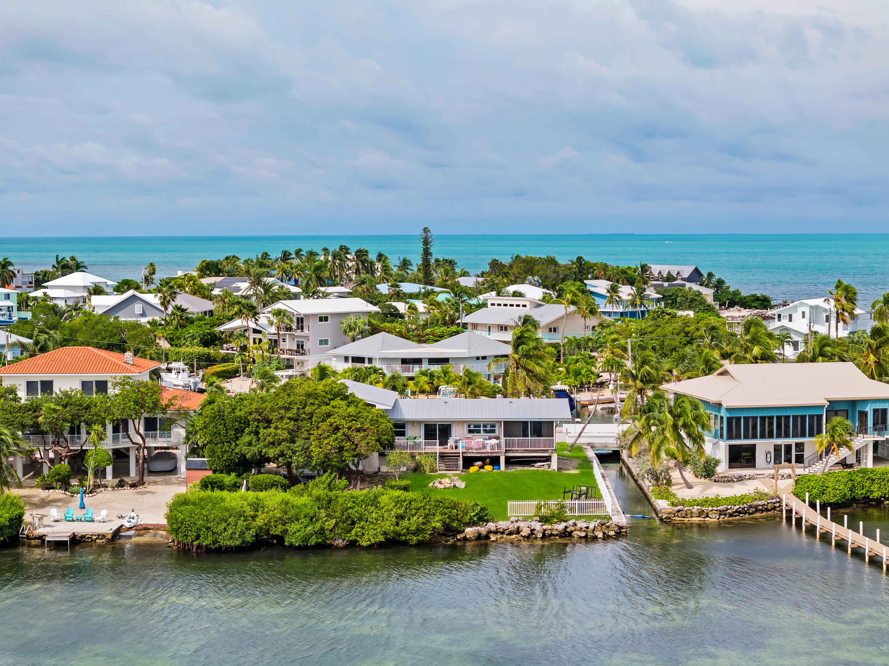 351 Stirrup Key Boulevard Marathon, FL 33050 - Photo 7 of 21 a view of swimming pool with outdoor seating and a garden