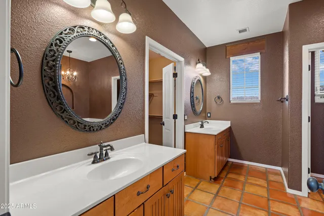 an empty room with window and fan