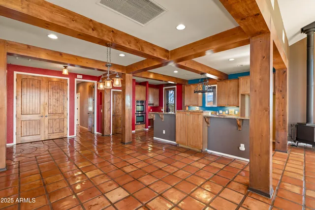 a spacious bathroom with a granite countertop sink and a large mirror