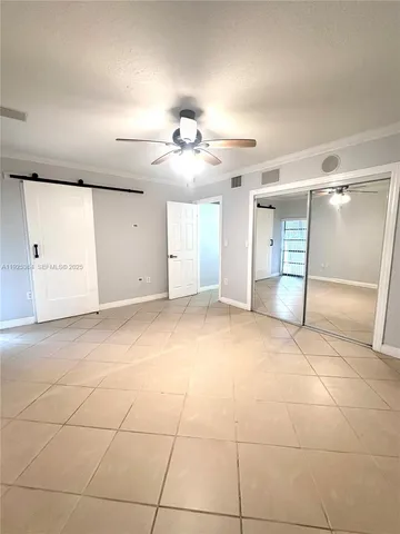a view of a livingroom with a furniture and chandelier fan