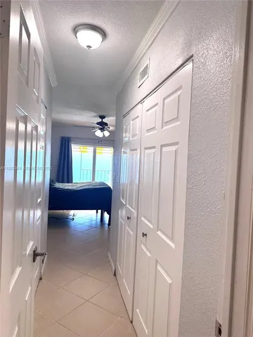 a view of a livingroom with furniture and windows