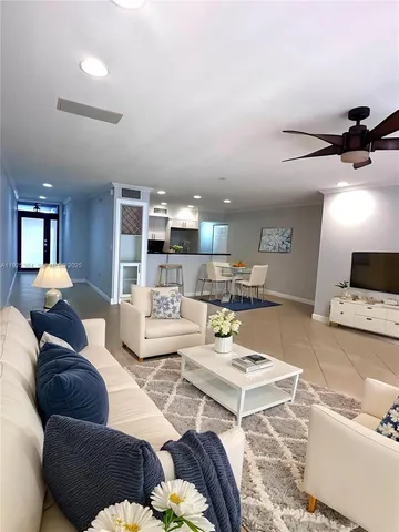 a living room with furniture and a lamp