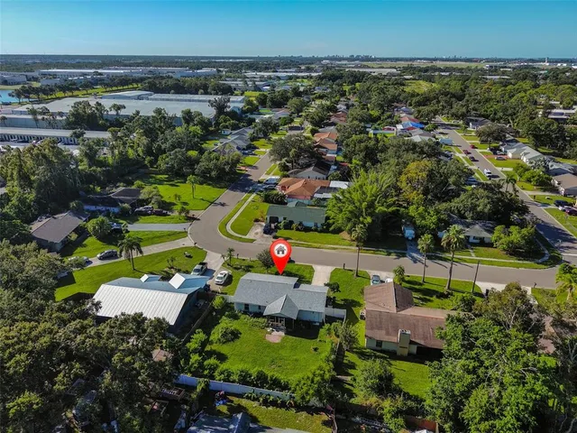 an aerial view of a house with a garden