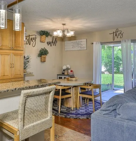 a dining room with furniture and window