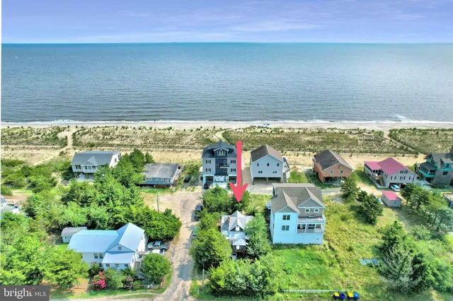 an aerial view of residential house with outdoor space and lake view