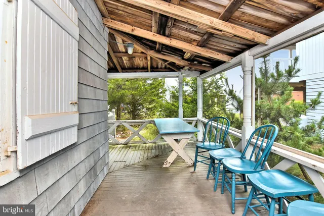 a kitchen with a window and a refrigerator