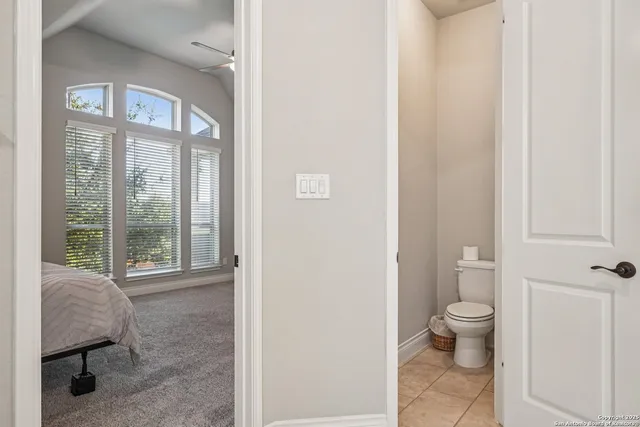 a view of a hallway with couches and a bookshelf