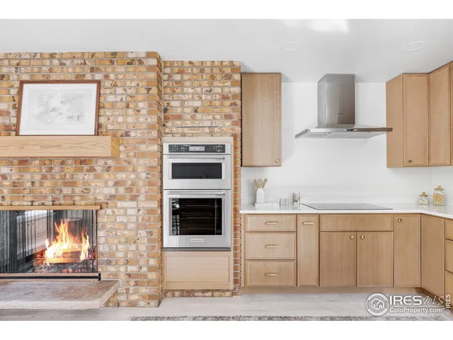 a kitchen with cabinets and appliances