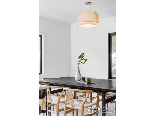 a bedroom with a bed and a lamp