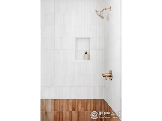 a spacious bathroom with a sink and a mirror