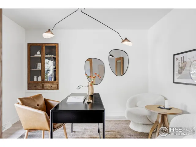a bathroom with a toilet a sink and a mirror