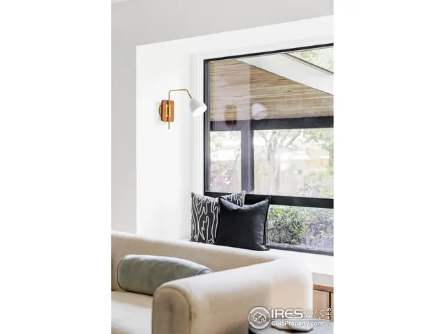 a living room with furniture and window