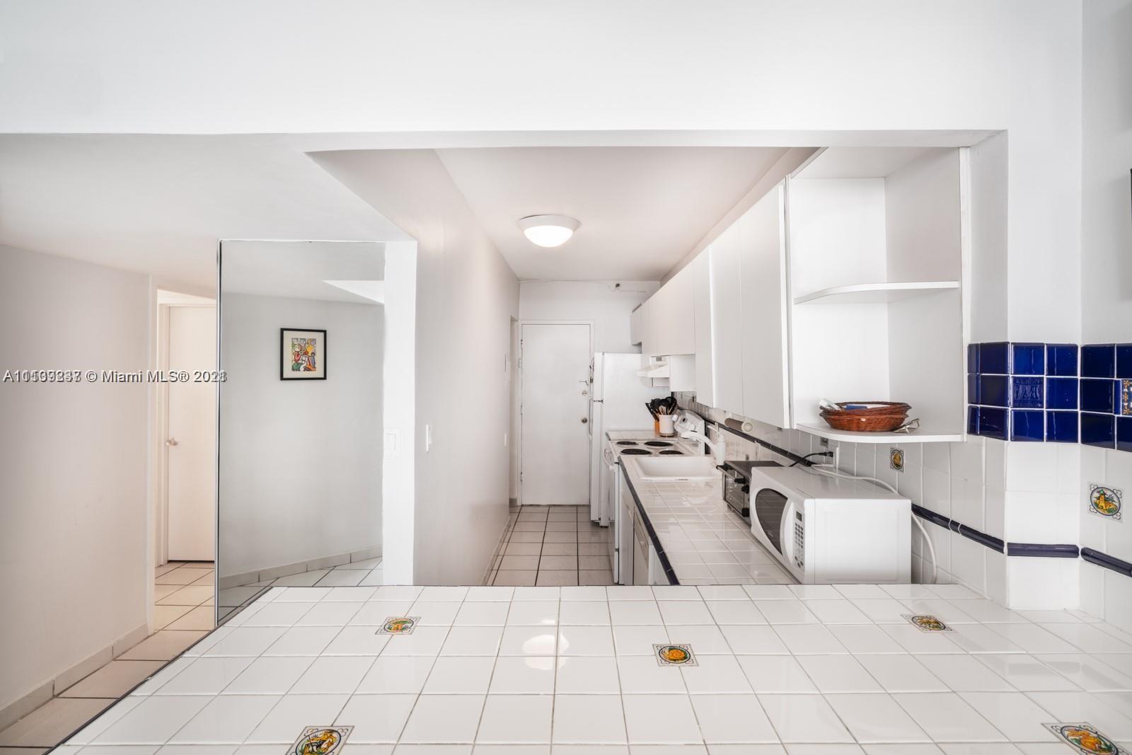 100 Lincoln Road, Unit 406 Miami Beach, FL 33139 - Photo 3 of 10 a living room with furniture and a table