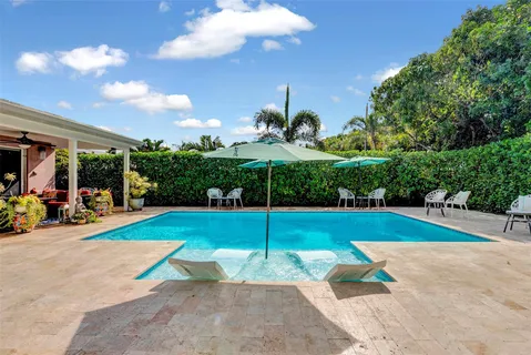 a view of a backyard with a patio