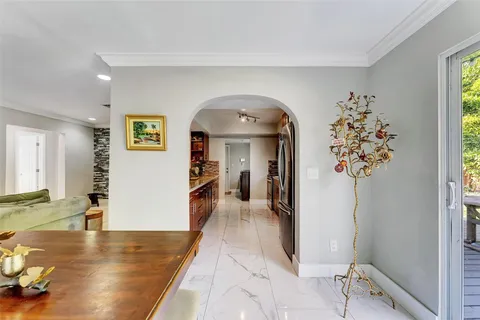 a view of a hallway view with wooden floor and staircase