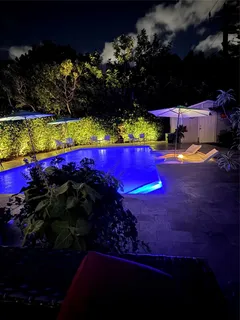 a view of swimming pool outdoor seating and city