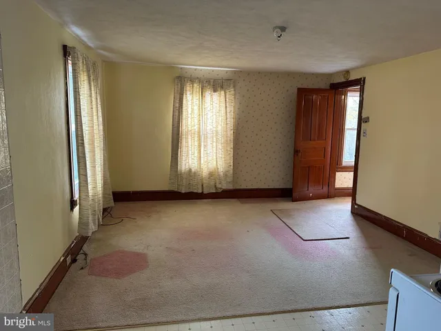 an empty room with windows