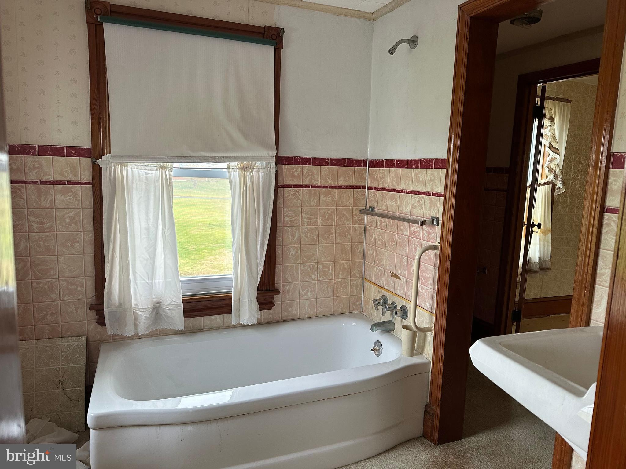 4847 Homeville Road Cochranville, PA 19330 - Photo 23 of 36 a bathroom with a bathtub and a shower