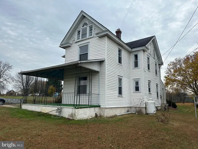 a tree in the garden of a house