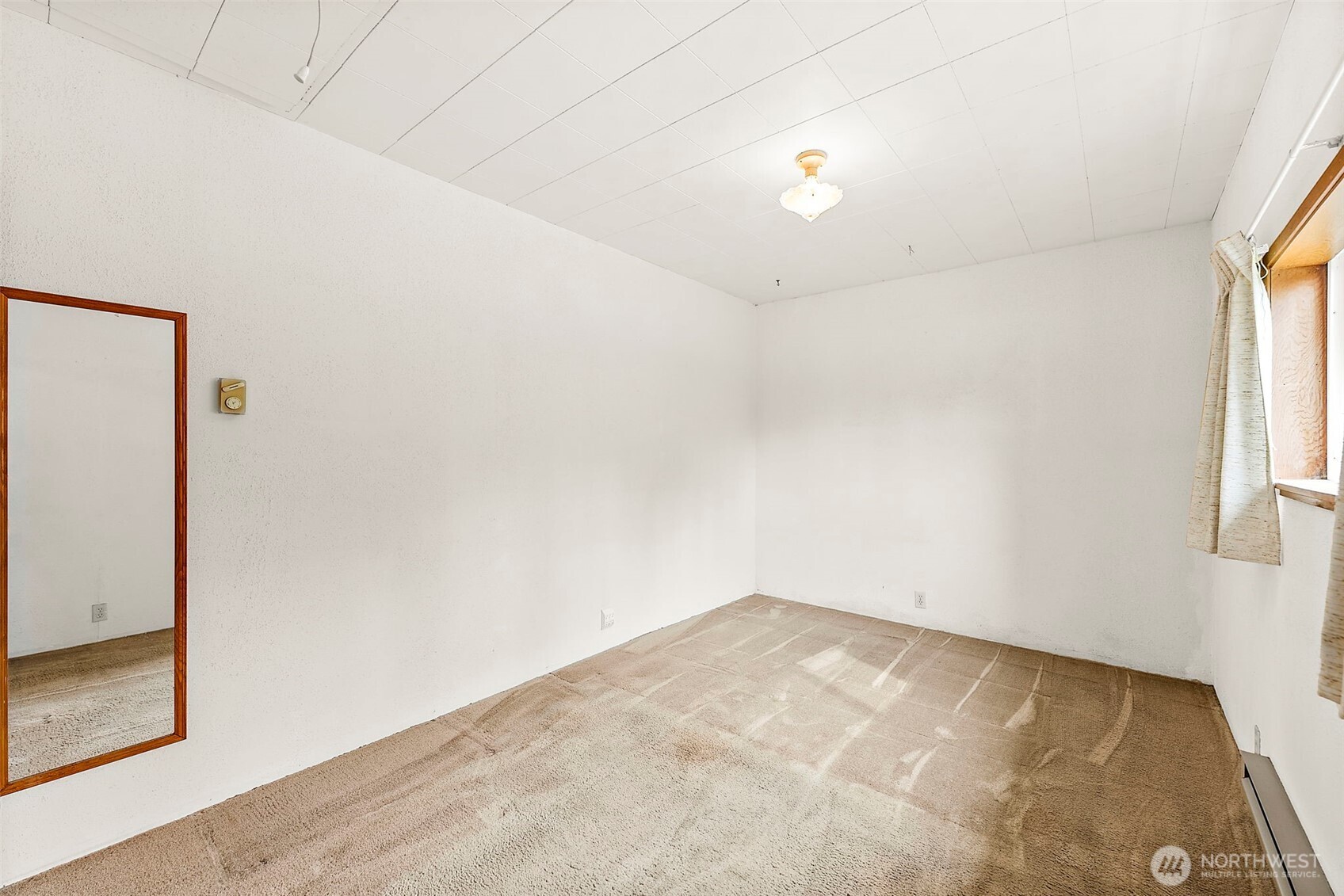 12106 County Line Road East Edgewood, WA 98372 - Photo 12 of 31 an empty room with windows