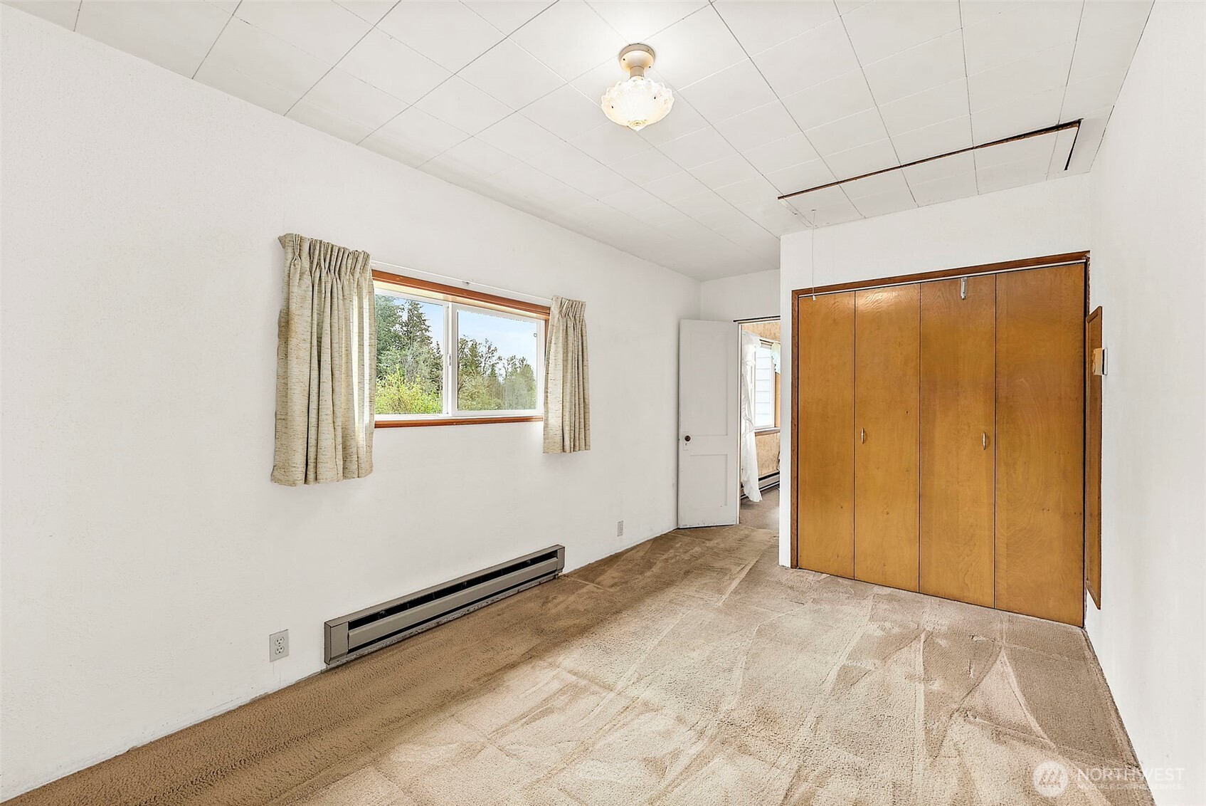 12106 County Line Road East Edgewood, WA 98372 - Photo 13 of 31 a view of an empty room with a window