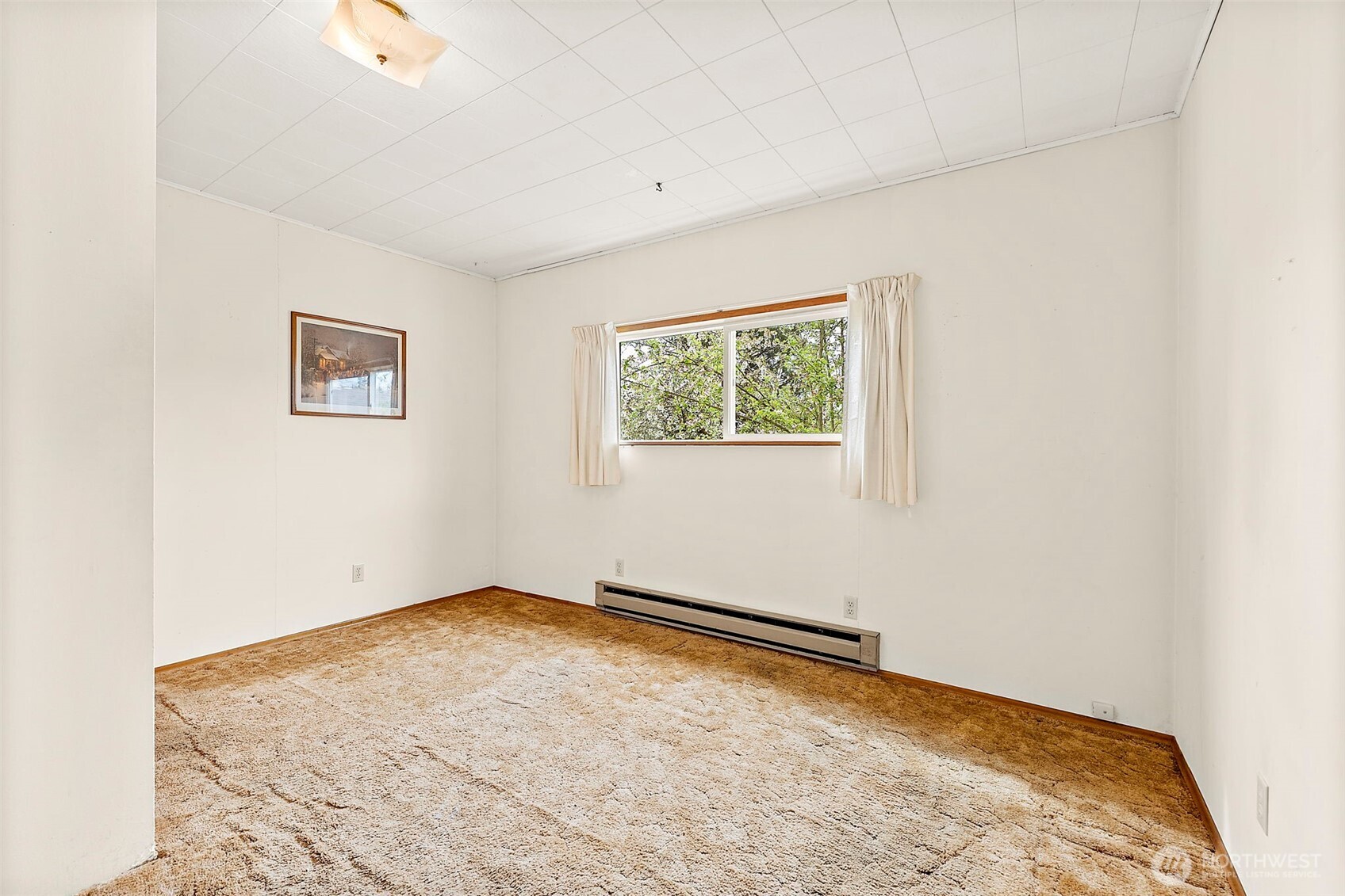 12106 County Line Road East Edgewood, WA 98372 - Photo 16 of 31 an empty room with a window