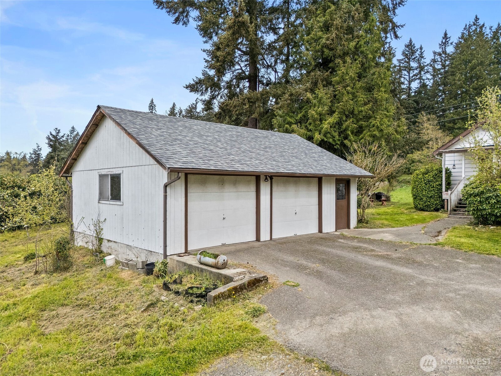 12106 County Line Road East Edgewood, WA 98372 - Photo 21 of 31 a front view of a house with a yard