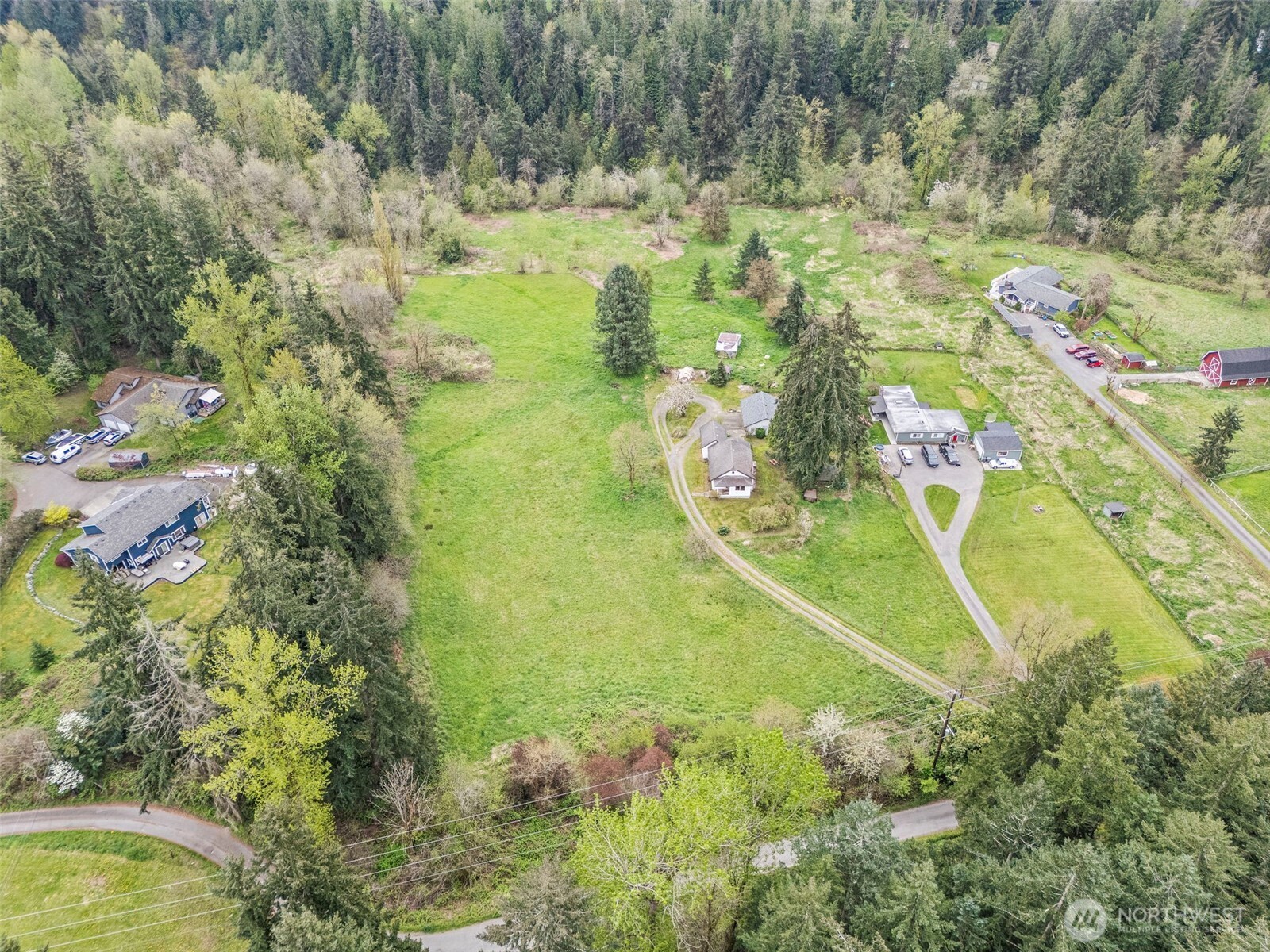 12106 County Line Road East Edgewood, WA 98372 - Photo 27 of 31 an aerial view of residential houses with outdoor space