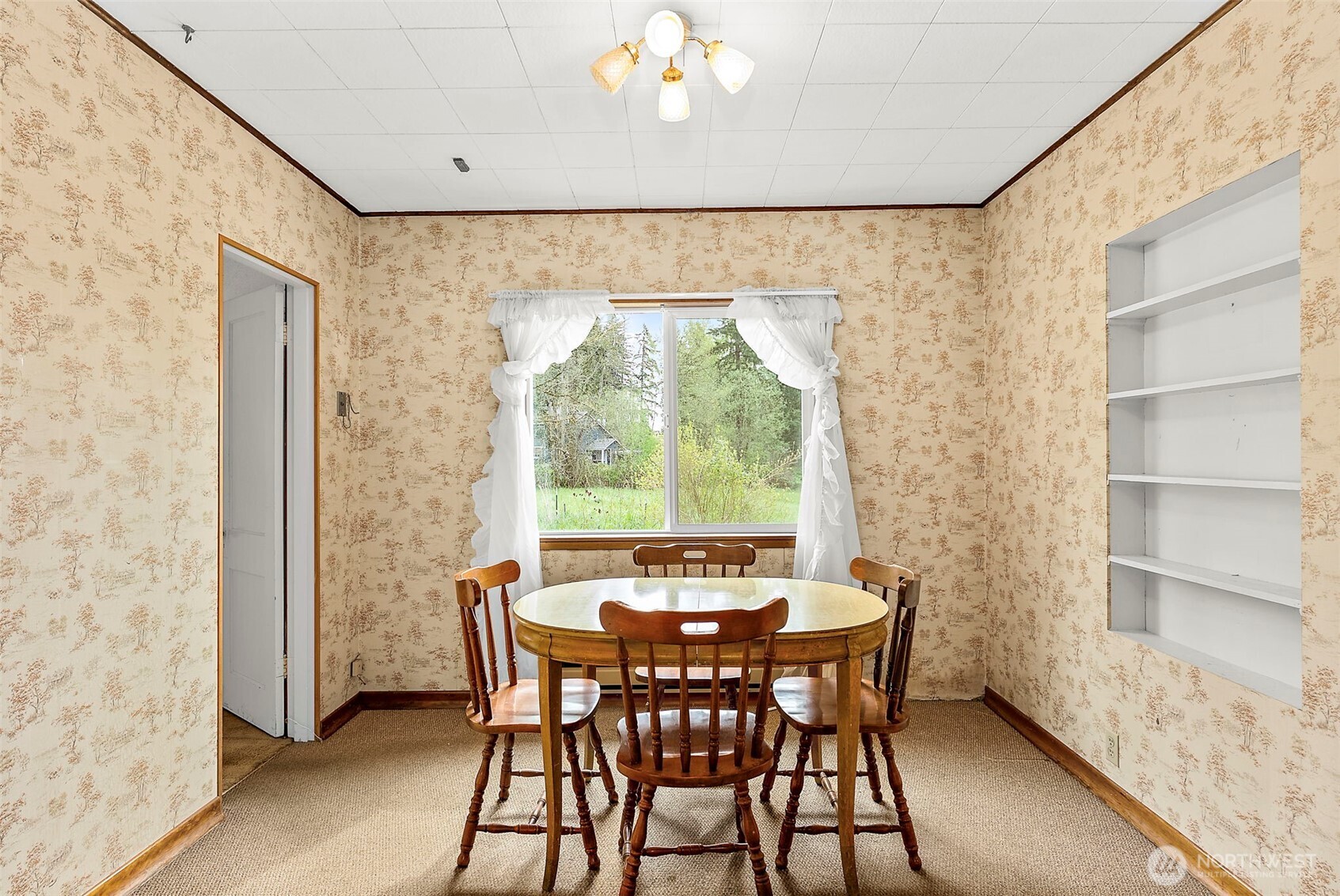 12106 County Line Road East Edgewood, WA 98372 - Photo 9 of 31 a view of a dining room with furniture window and outside view
