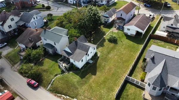 an aerial view of residential house with outdoor space