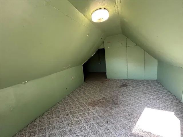 a kitchen with a sink cabinets and window