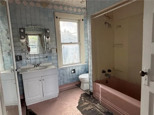 a kitchen with a sink cabinets and window