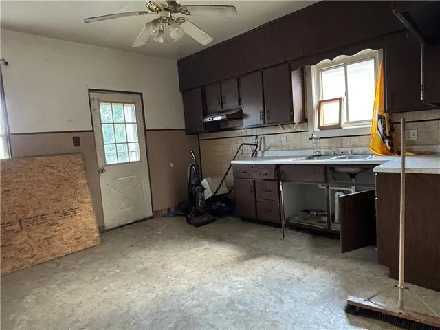 a view of a porch with a table and chairs