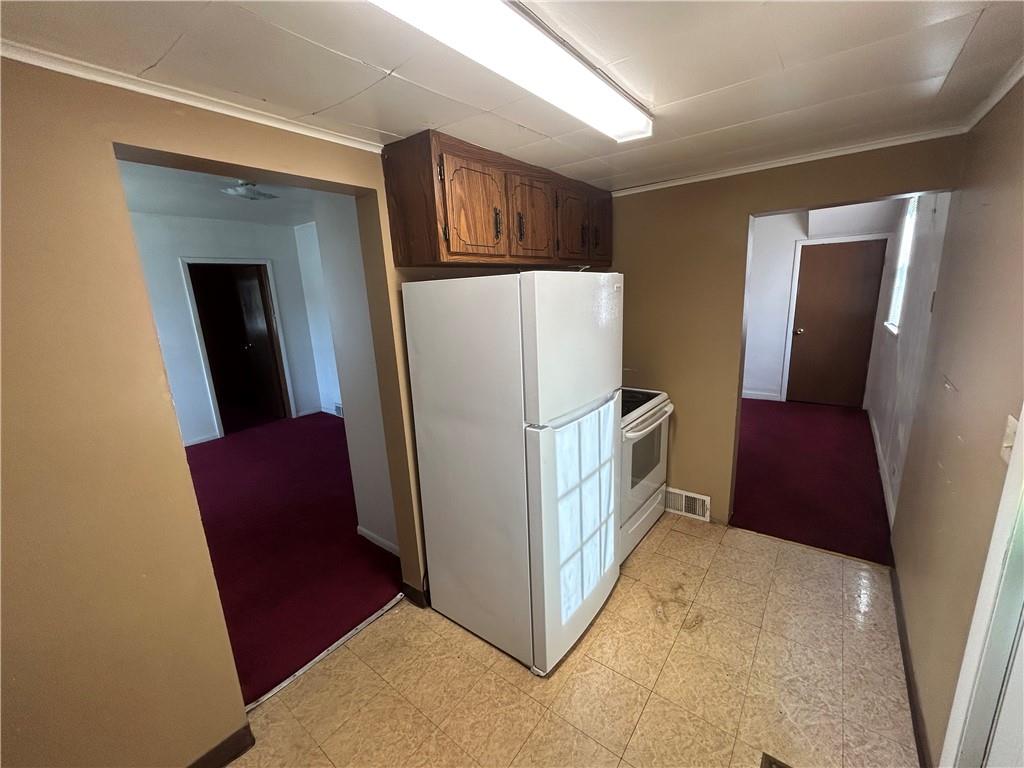 932 5th Street Charleroi, PA 15022 - Photo 8 of 26 a view of hallway with furniture and a refrigerator