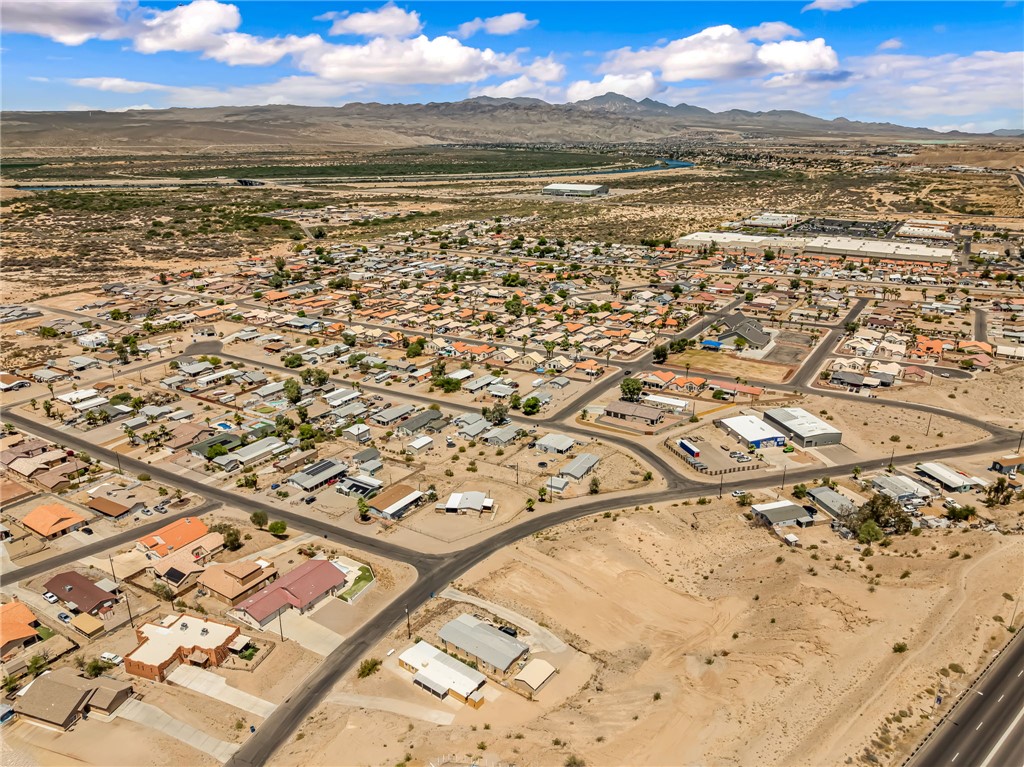 3880 Rising Sun Road Bullhead City, AZ 86442 - Photo 34 of 42 Aerial perspective showcasing a residential community with varied rooflines and surrounding arid landscape