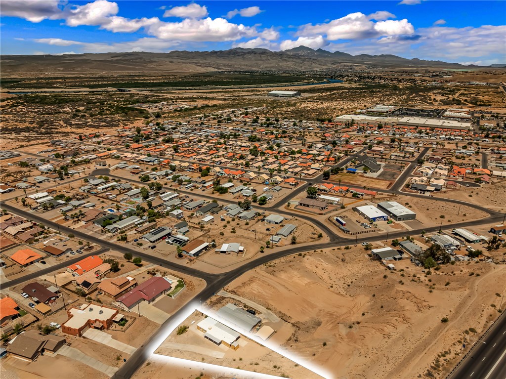 3880 Rising Sun Road Bullhead City, AZ 86442 - Photo 38 of 42 Aerial perspective showcasing an expansive desert landscape and a residential area