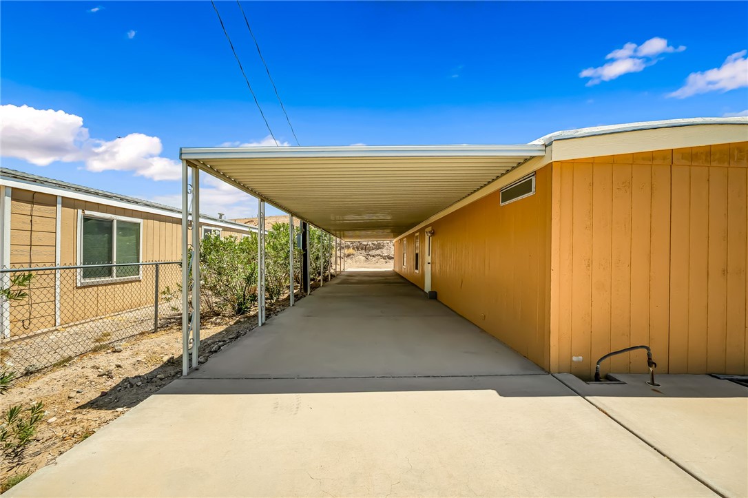 3880 Rising Sun Road Bullhead City, AZ 86442 - Photo 8 of 42 Extended carport structure providing covered outdoor space