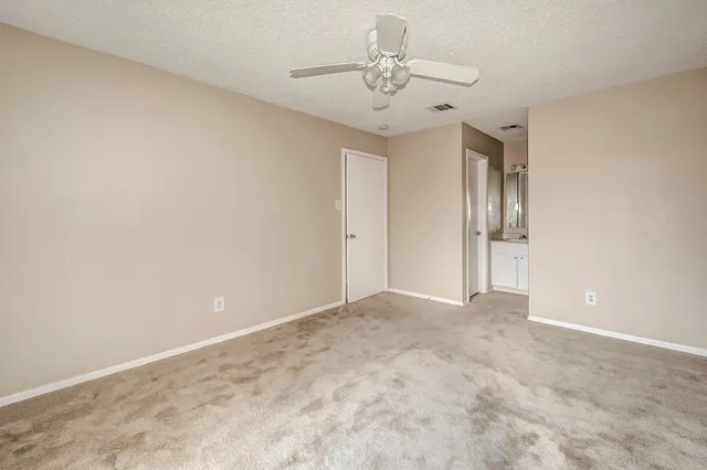 a bathroom with a bath tub with a shower