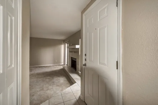 a view of a hallway with an entryway