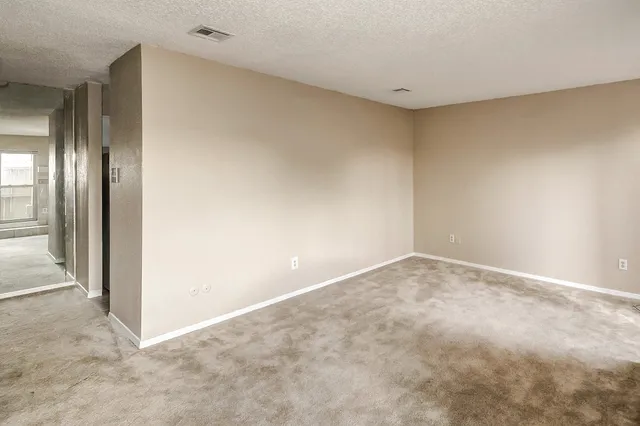 a view of a bathroom with a shower and a sink