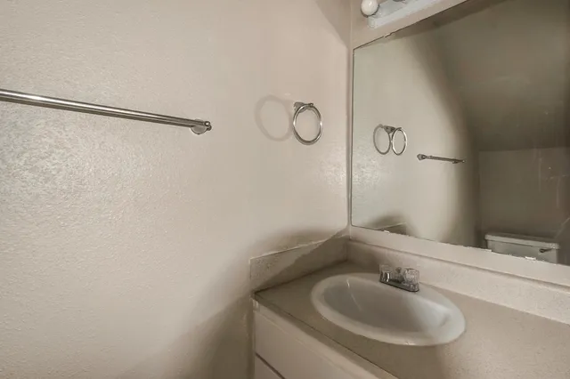 a kitchen with a sink appliances and cabinets