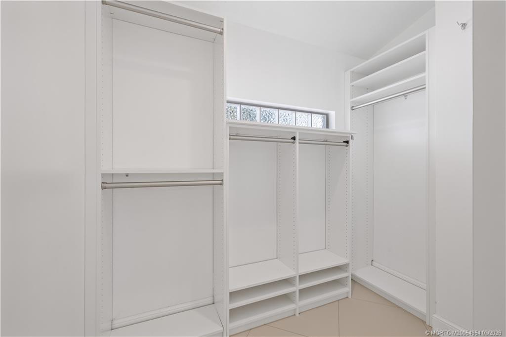 1359 Southwest Dyer Point Road Palm City, FL 34990 - Photo 28 of 55 a view of walk in closet with empty racks