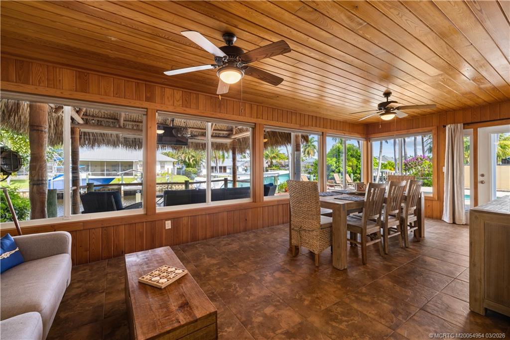 1359 Southwest Dyer Point Road Palm City, FL 34990 - Photo 46 of 55 a dining room with furniture window and outside view
