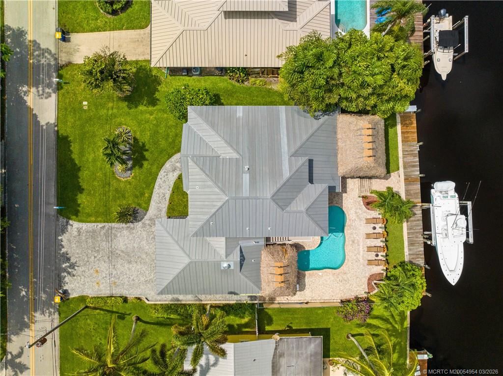 1359 Southwest Dyer Point Road Palm City, FL 34990 - Photo 6 of 55 an aerial view of a house with a swimming pool