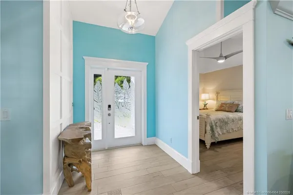 a view of a hallway with closet and a livingroom view