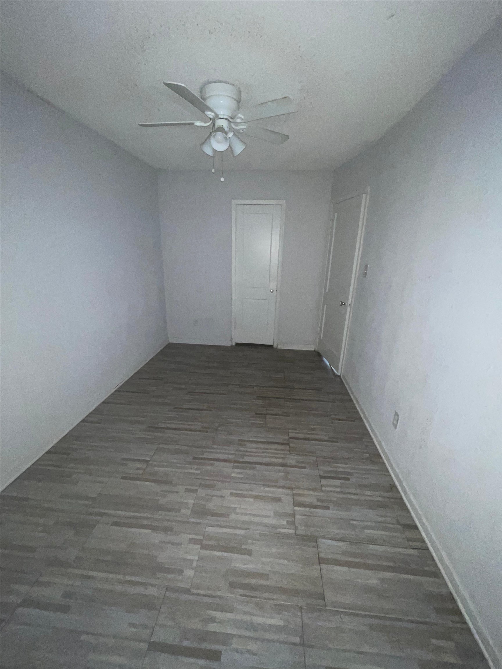 271 West Brooks Road Memphis, TN 38109 - Photo 11 of 17 Unfurnished bedroom featuring a ceiling fan, a closet, and a textured ceiling