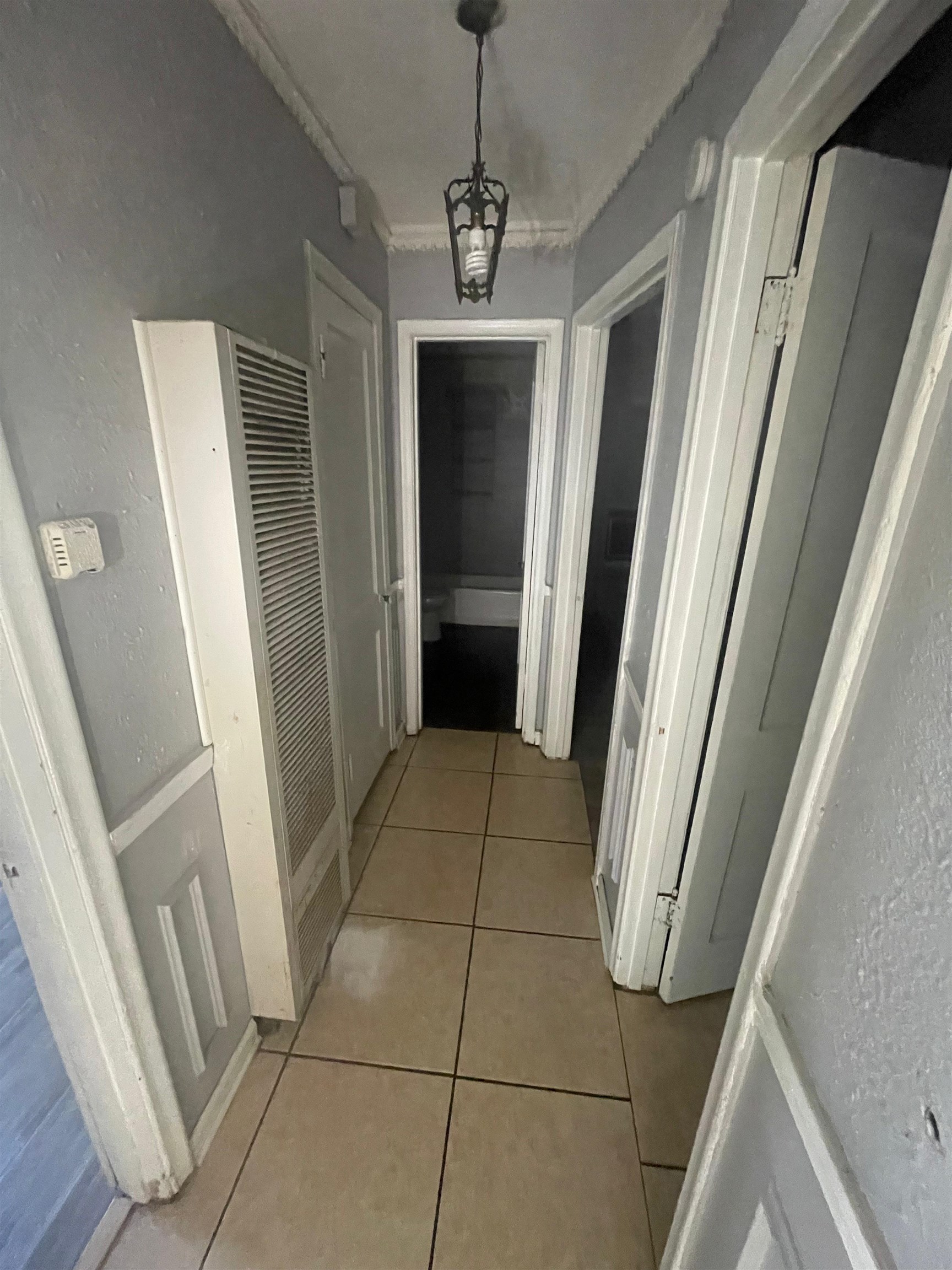 271 West Brooks Road Memphis, TN 38109 - Photo 8 of 17 Corridor with a heating unit and light tile patterned floors