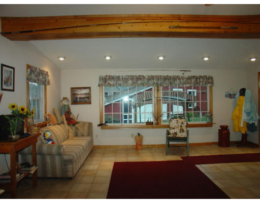 129 Walnut Hill Road Orange, MA 01364 - Photo 11 of 23 a living room with furniture and a large window
